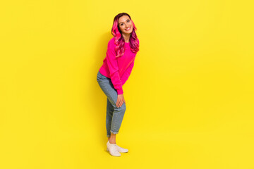 Fototapeta na wymiar Full length photo of dreamy cute girl dressed vibrant pullover smiling isolated yellow color background