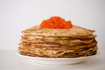 pancakes in a plate with red caviar