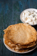 Delicious thin ruddy pancakes with sweet cottage cheese filling