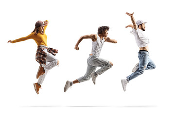 Full length profile shot of a caucasian male and female and an african american male dancers jumping