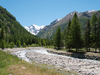 Fototapeta na wymiar Around Lillaz waterfalls. Rivers. Cogne - Aosta Valley. Alps, Italy.