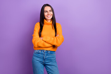 Photo of charming positive person folded arms toothy smile look empty space isolated on violet color background