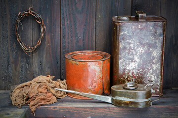 Digital photography depicting my grandfather's workstation with old paint canisters, rusted wire...