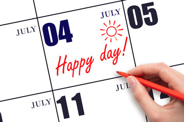 Hand writing the text HAPPY DAY and drawing the sun on the calendar date July 4