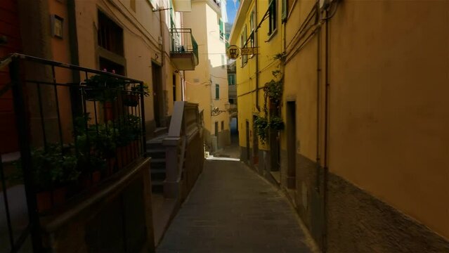 Colorful apartment homes in touristic town, Riomaggiore, Italy. Cinque Terre National Park. Slow Motion Cinematic
