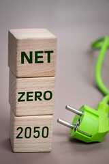 net zero 2050, Written on wooden blocks, Environmental concept, green cable, renewable energy...