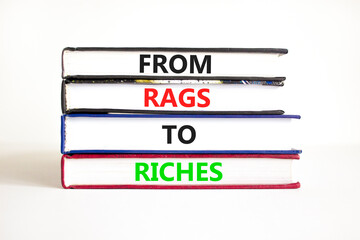 Rags or riches symbol. Concept words From rags to riches on books. Beautiful white table white background. Business rags or riches concept. Copy space.