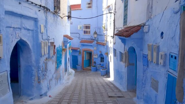 POV Walking Down Empty Street With Blue Painted Buildings In Chefchaouen, Morocco 