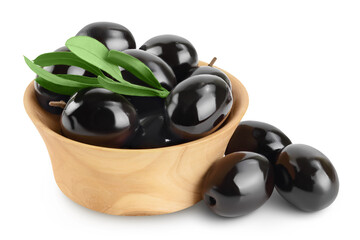 Black olives with leaves in wooden bowl isolated on a white background with full depth of field.