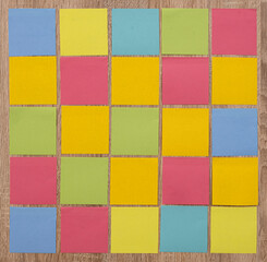 empty colorful post it on wooden background