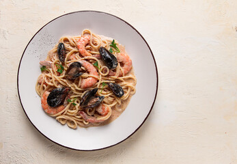 Spaghetti, pasta, with seafood, shrimp with mussels, in creamy garlic sauce, homemade, no people,