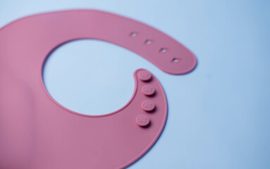 Details of a silicone bib for babies. Baby feeding and nutrition concept. Top view, flat lay....