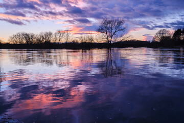 flooded fields in winter at sunset