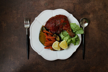 Close up Roasted Chicken with Grilled vegetable for side dish