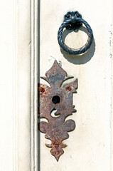Knocker on old white wood door in Santana do Parnaiba, colonial city in State of Sao Paulo, Brazil