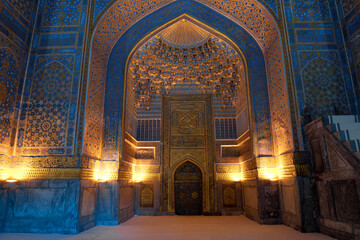 Mihrab - a niche indicating the direction to Mecca. The interior of the old mosque of the...