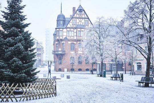Downtown of Schwedt during winter with snow and trees