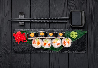 Sushi rolls with salmon, crab, shrimps and spicy sauce