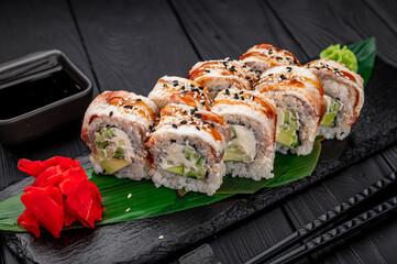Sushi rolls japanese food on a dark background. Roll with eel