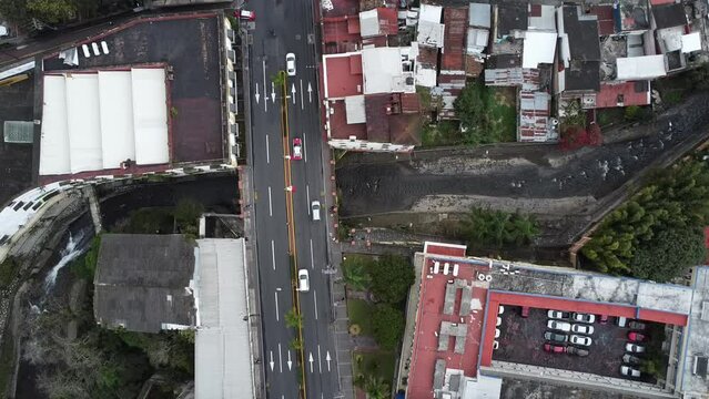 a drone view of a bridge in a town, creek in the city, orizaba, veracruz, latin america, america, downtown, landscape