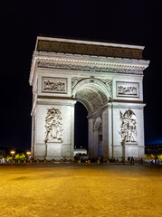 Fototapeta na wymiar Triumphal arch (Arc de Triomphe) at night, Paris, France