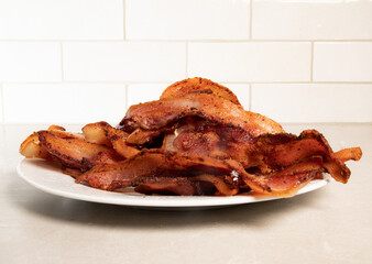pile of bacon on white plate