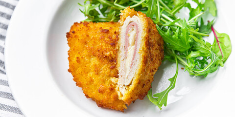 cordon bleu cutlet chicken meat, cheese, bacon meal snack on the table copy space food background rustic top view