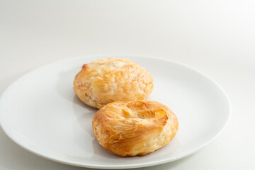 Traditional Turkish breakfast bagel; İzmir Boyoz or round borek. Turkish pastry.