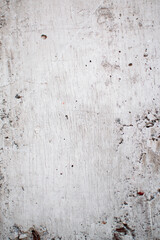 Fondo de textura de una pared desgastada de cemento color blanco ideal para fondos abstractos