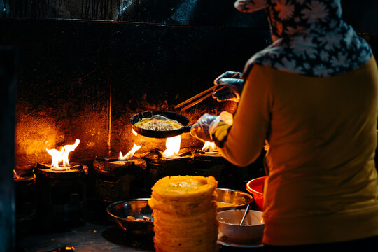Woman Making Banh Xeo, Hoi An Vietnam