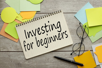 Investing for Beginner . text on a notepad page. notepad on the background of stickers