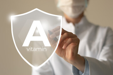 Molecular model of vitamin A, retinol. Shield in doctor`s hands with Vitamin A