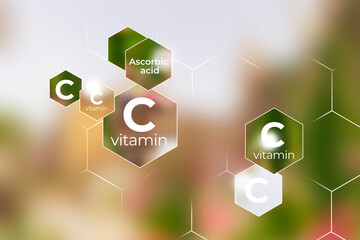 Immunity protection concept, vitamin C. Hexagons with Vitamin C name, blurry pink floral  background.