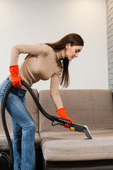 Dry cleaning extractor machine is spraying water and detergent close-up. Professional domestic...