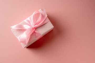 Valentine's day gift pink box and pink satin bow, copy space, birthday, Mother's Day