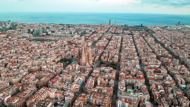 Aerial view of the Barcelona city from above at sunset. Timelapse 4k aerial view of life in Barcelona.