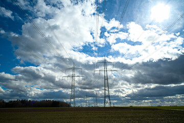 Fototapeta na wymiar power lines on a field