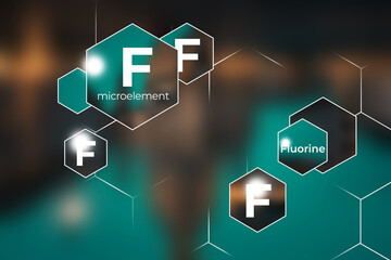 Microelement supplement concept, Fluorine. Hexagons with Fluorine icon, blurry blue  background.