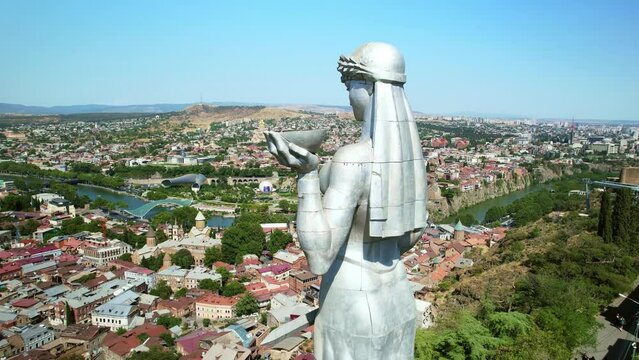 Drone view Mother of Georgia monument in Tbilisi old town, Georgia's capital. famous tourist attraction, Summer travel in Georgia.