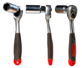 The ratchet key to unscrew the screws used in a mechanical workshop. Isolated background.