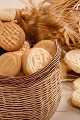 Closeup of basket with biscuit and wheat - generative ai