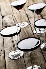 Foto op Aluminium Glasses with red wine on wooden background, with copy space © vectorfusionart