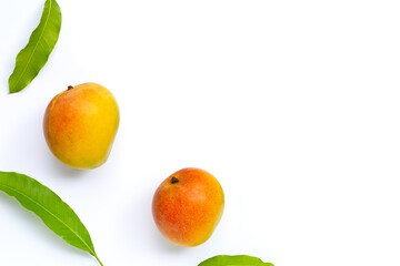Mango, Tropical fruit with leaves on white background. Top view