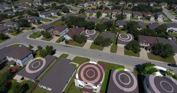 An aerial view establishing shot of a typical midwestern residential neighborhood with WiFi hotspot markers over random homes. Texas suburbs.	