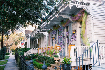 Row of Historic Shotgun Double Houses with Mardi Gras Decorations in New Orleans, Louisiana, USA