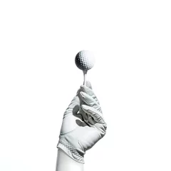 Foto auf Acrylglas Hand with Golf Glove Holding Golf Ball on a Tee © Wesley
