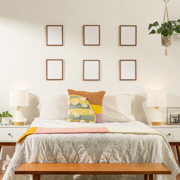 Empty Wooden Picture Frames in a Bedroom 