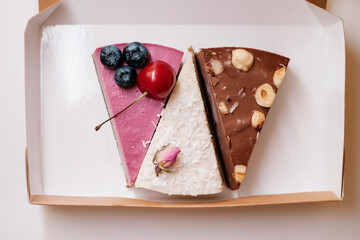 Sweets with nuts, chocolate and berries in box. Food delivery