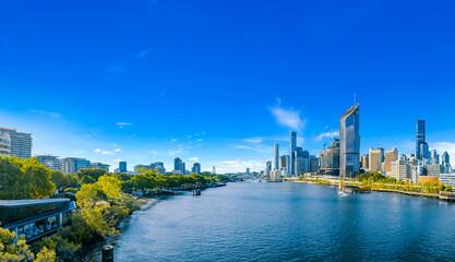 Beautiful sunny day afternoon panorama overlooking South Bank Parklands, The Brisbane River, and Brisbane's City Skyline during summer