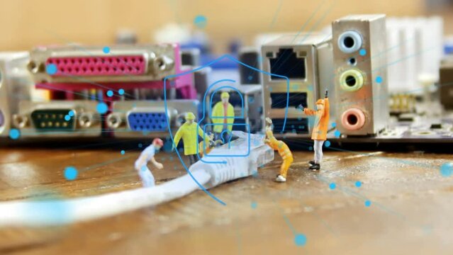 Animation of spots and padlock icon over toy workers holding usb cable